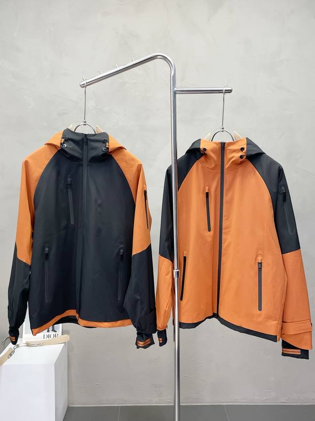 Exclusively from Zegna, this stylish hooded jacket boasts a classic design and