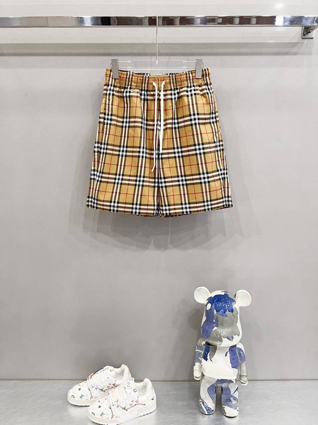 Burberry custom woven cotton shorts. Classic brand check with logo. Officially s