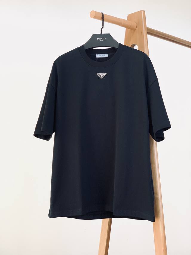 Prada's new Spring/Summer 2025 collection, DDD, features a casual pullover T-shi