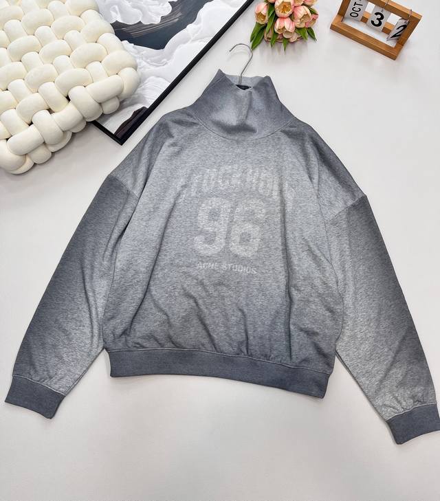Acne Studio's gradient grey sweatshirt with a stand-up collar and 96 logo on the