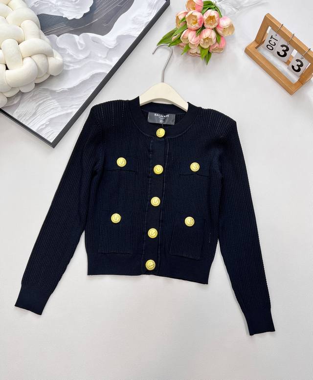 Balmain Gold-Buttoned Knit Cardigan. As a representative of the French luxury br