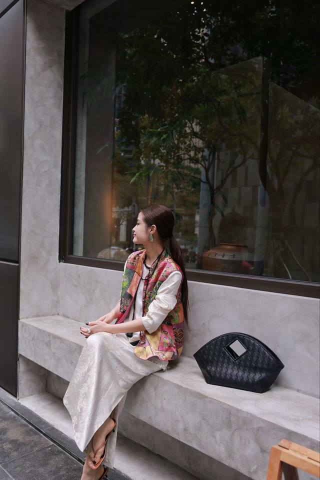 Exclusively customized, this patchwork vest features a multi-colored block patt