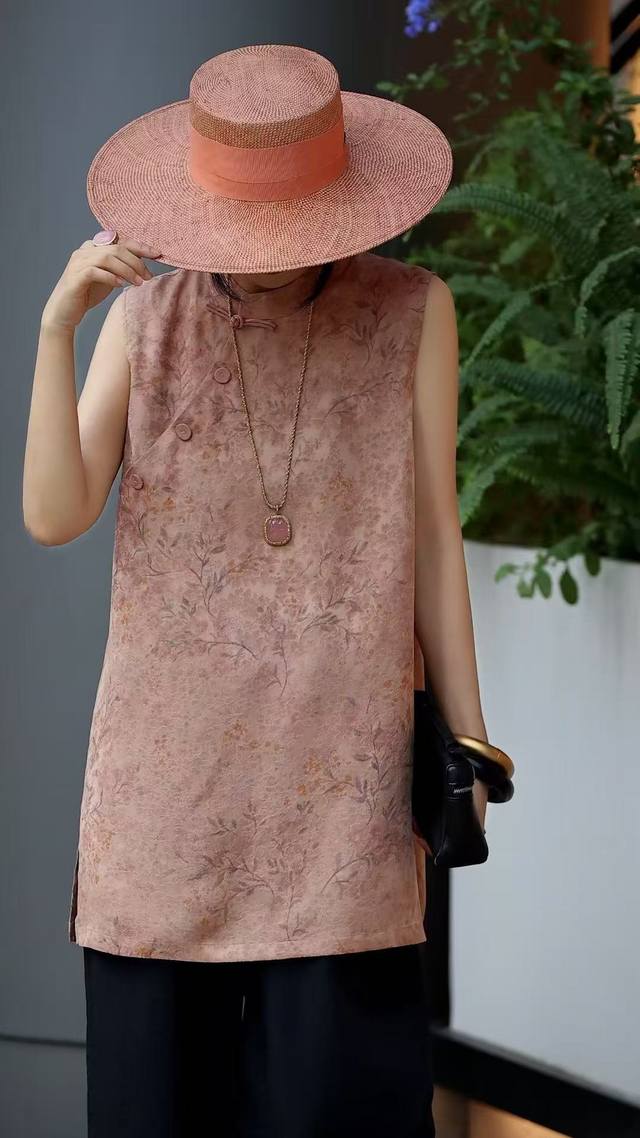 Oriental poetry meets modern tailoring in this 100% rayon floral buttoned top,