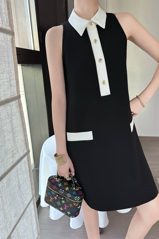 Louis Vuitto*'s new vest dress is stylish, understated, and luxurious! The versa