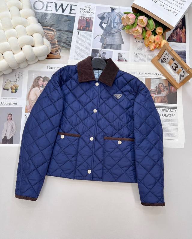 Prada's classic square-neck, quilted, thin, cropped puffer jacket features a squ