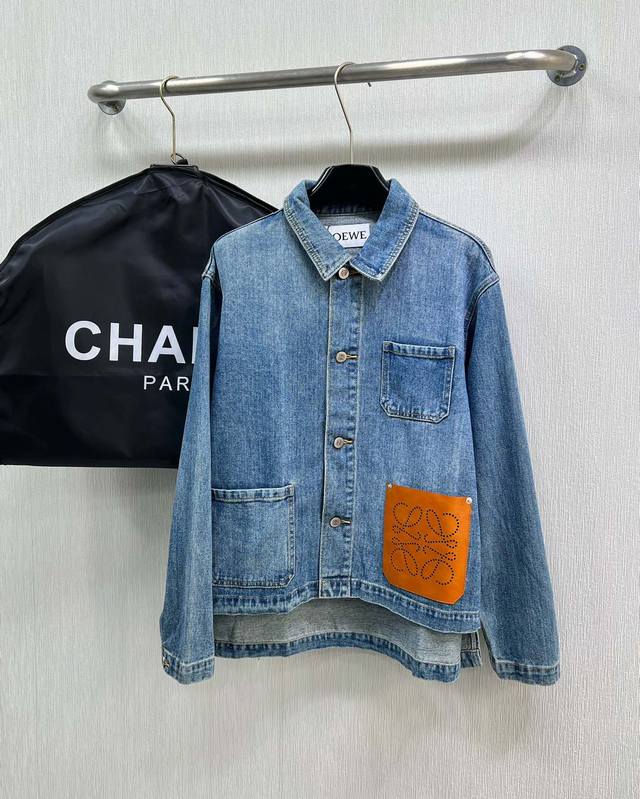 Loewe denim jacket, with large leather pockets on the body, is extremely fashion