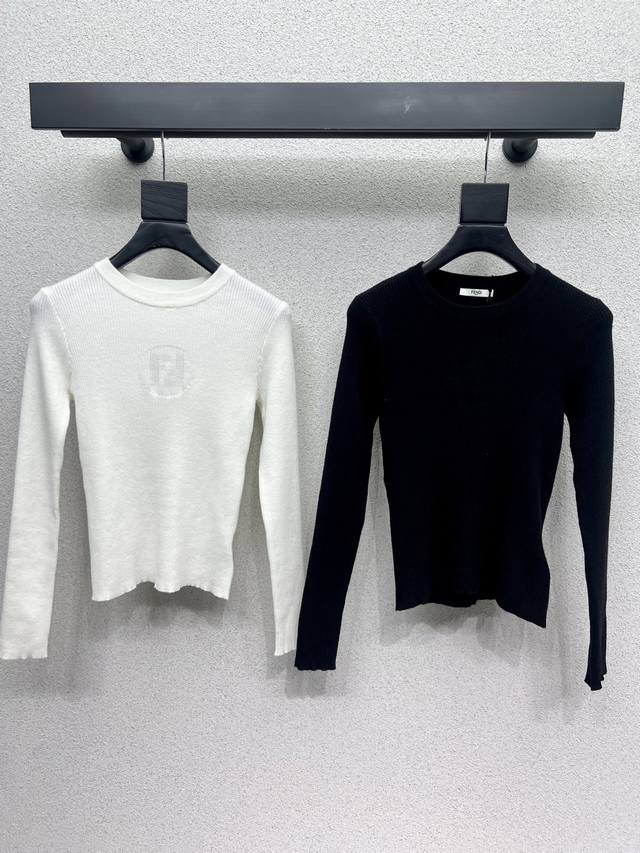 Fd's knitted wool top is a classic, age-defying piece with a soft, delicate text