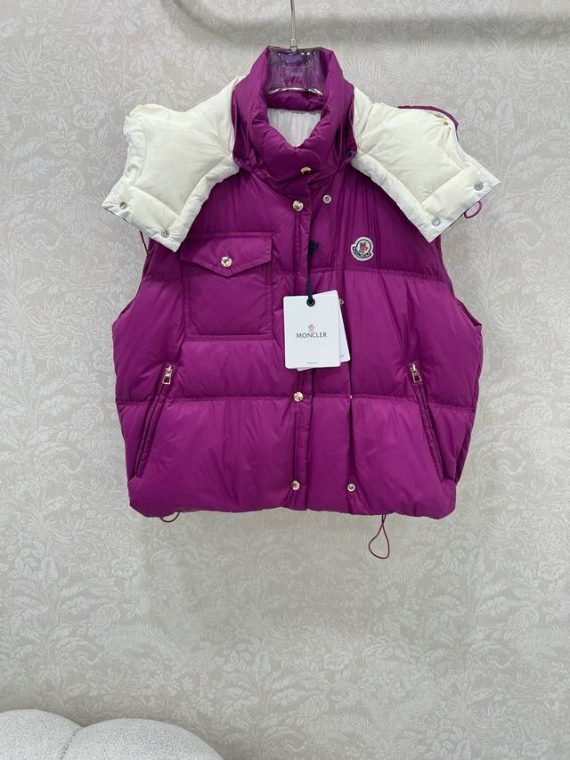 Moncle* 25's new detachable hooded, stand-up collar down vest in a high-top vers
