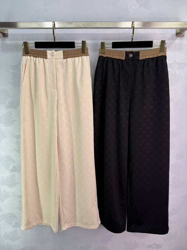 Gucc* 25 new wide-leg trousers with allover monogram and Double G print. Contras