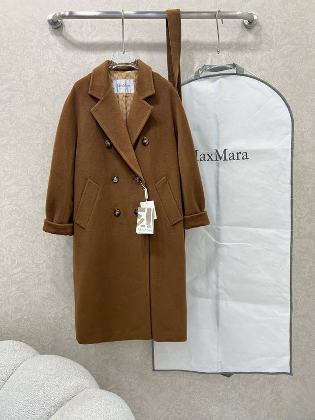 Maxmara's unisex cashmere coat, model 101801, is completely custom-made from the