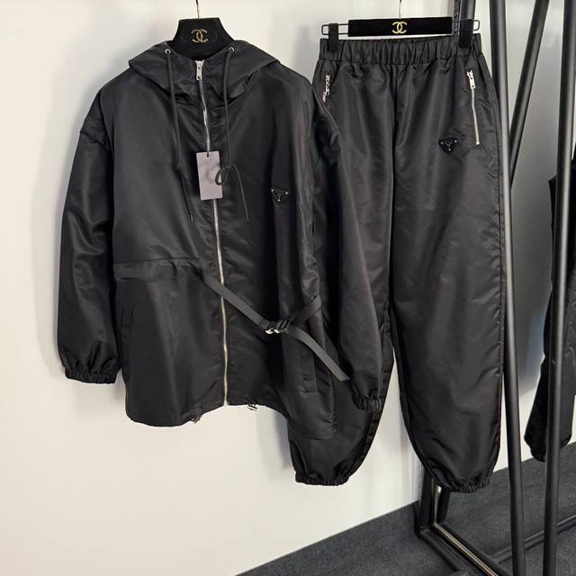 Style No. 20255098 Prad*'s newest sports suit, featuring a long-sleeved, hooded