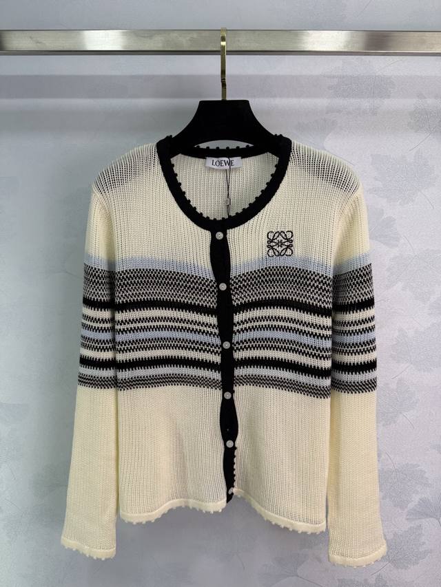 Loe*25's new early fall striped knitted cardigan features a round neckline with