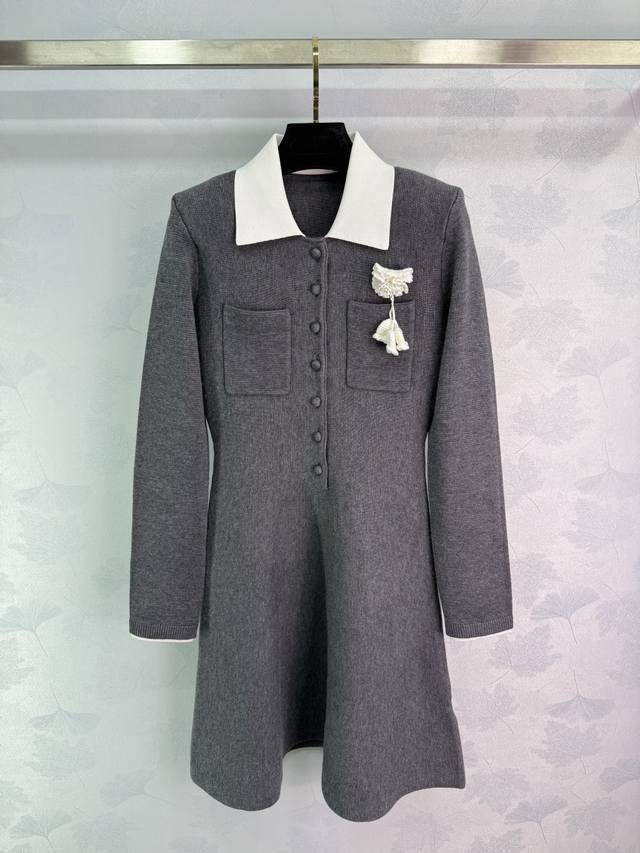Se*25 New Early Fall Knit Dress with a white lapel and a small flower brooch. Th