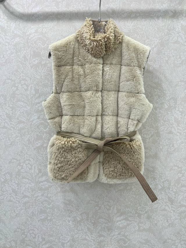 Moncl*R25's latest high-end Teddy Plush Snap-Button Down Vest. The front panel i