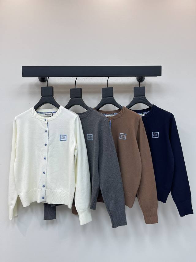 Miumi*25's new early fall round-neck knit cardigan features a logo embroidered j