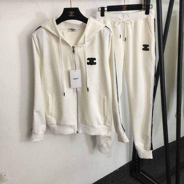 Style No. 9719 Celin*'s newest sports suit, featuring a long-sleeved hooded zip