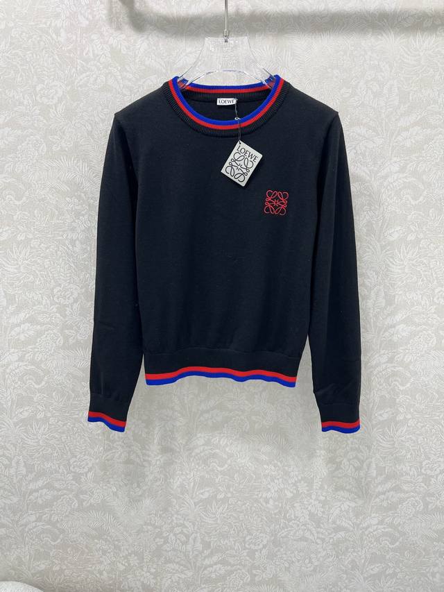 Loew**25's new round-neck pullover knitted wool sweater features an embroidered