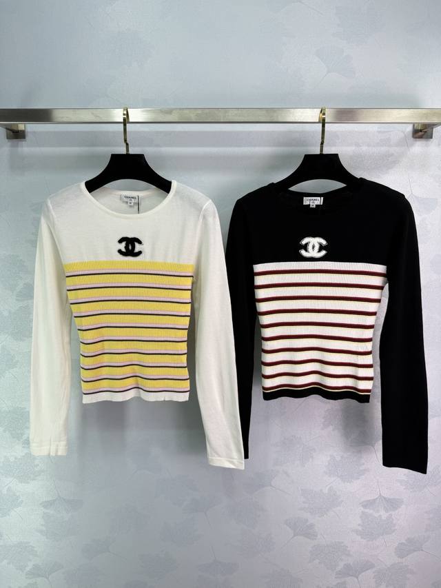 Chane* Classic striped knit top available in white or black. Double C logo on th