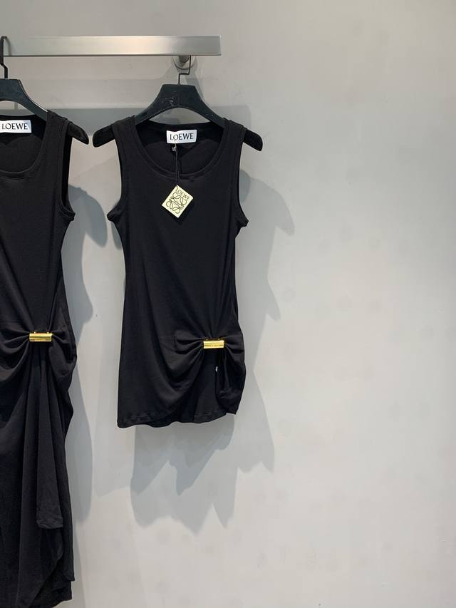 Originally developed by Loew*, this stylish, retro, gold-buttoned irregular kni