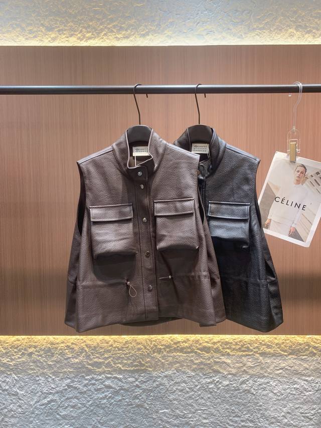 Maison Margiela's sleeveless vest is crafted from matte PU leather in a coffee a