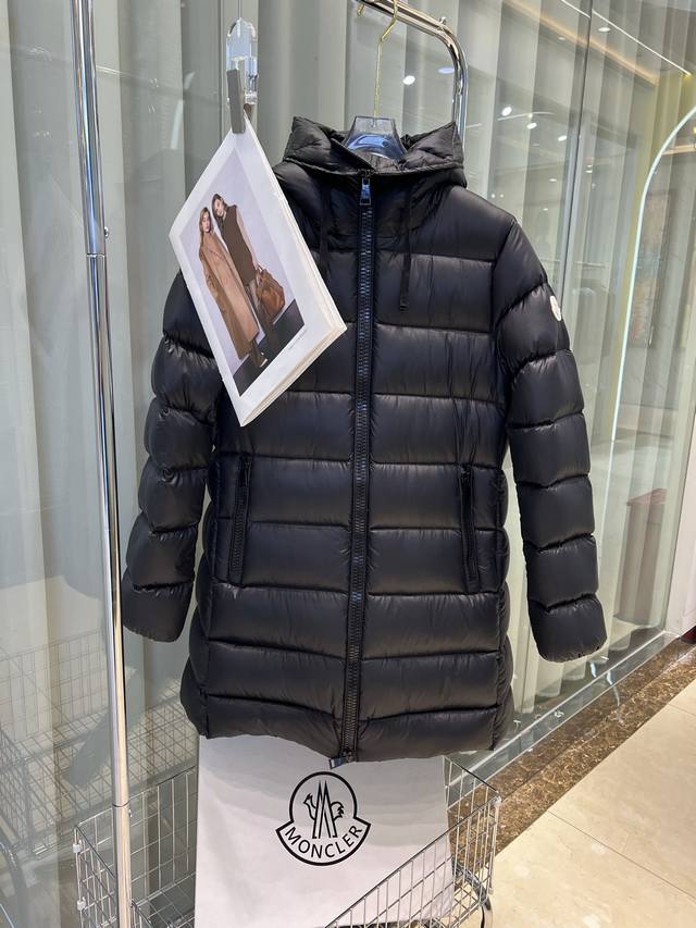 Moncler's classic babydoll style, the Moncler Suyen women's long down jacket. Th