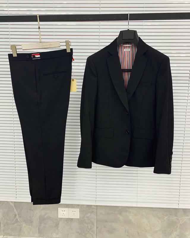 A classic, solid-color suit in a classic silhouette, a must-have for your wardro