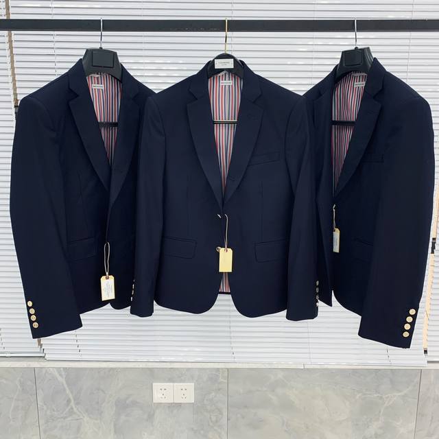 A classic, solid-color suit in a classic silhouette, a must-have for your wardro