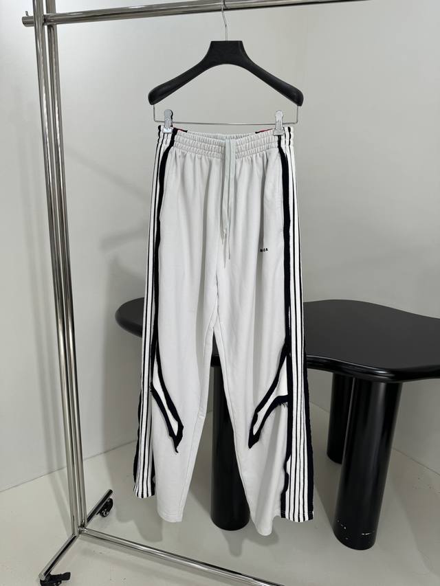 New arrival: Cut-Up Track Pants Cut-Up Track Pants in faded black and white Uni
