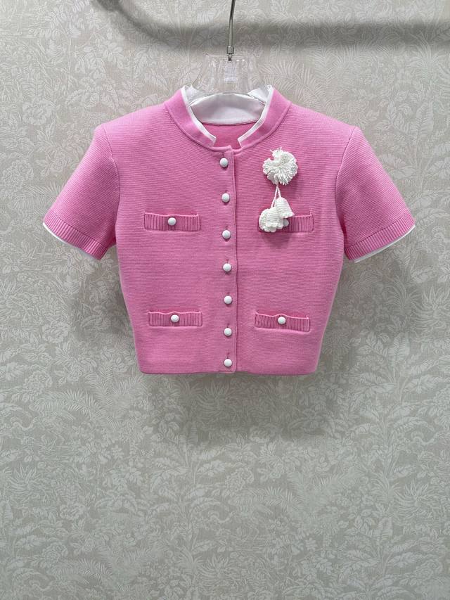 Self-Portrait 25's new pink short-sleeved wool blend knit top is a gorgeous pink