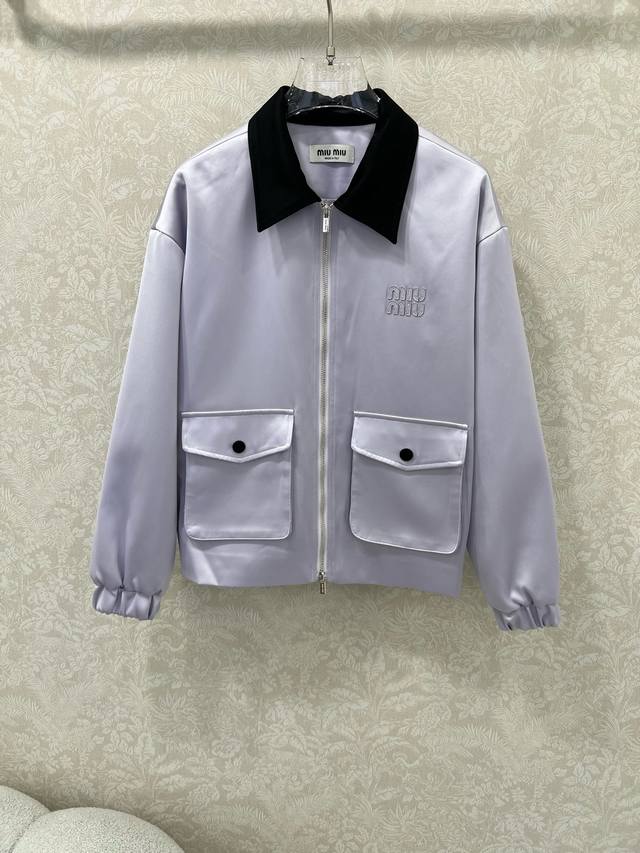Miumi*25's new satin lapel jacket features a zippered collar and large front poc