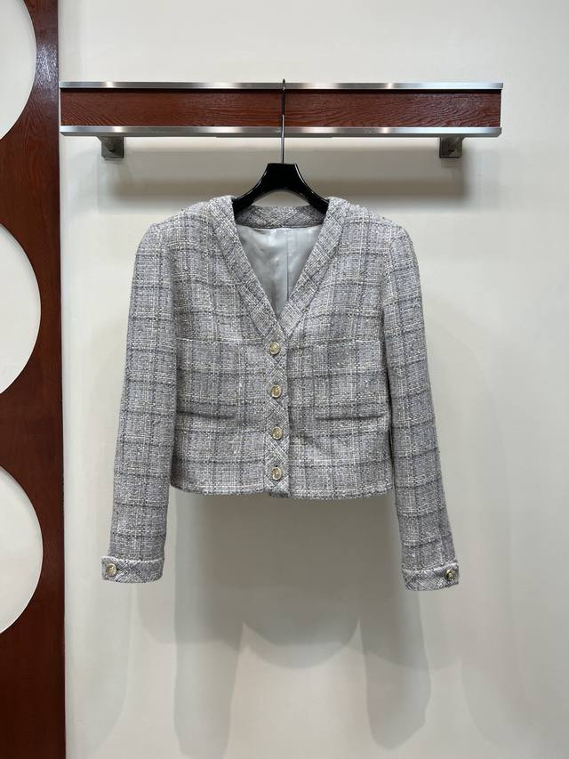 Chanel's new early fall 25 checked tweed V-neck cropped jacket has a French lady