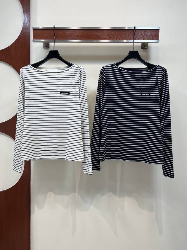 Miu's new striped off-the-shoulder long-sleeved top for early fall 2025. Small l