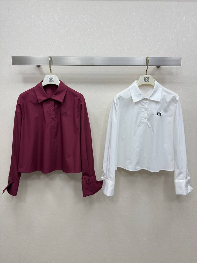 25Ss Loew's striped shirt features an embroidered logo on the chest. This short