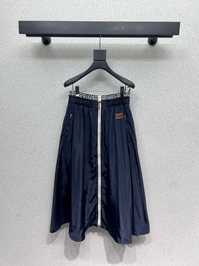 Miu's zippered nylon skirt is a classic, age-defying piece with a delicate, sof