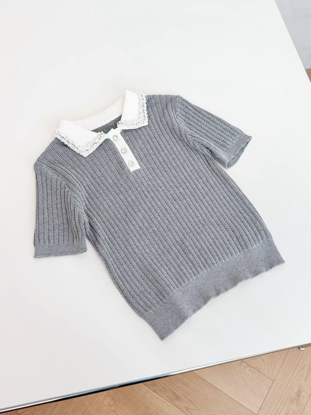 25Ss Early Fall New Arrivals! This short-sleeved sweater with a beaded collar fe