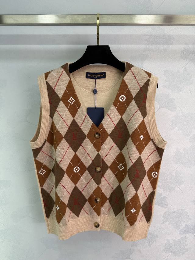Lou*25's new early fall diamond-patterned knitted vest features a V-neck, button