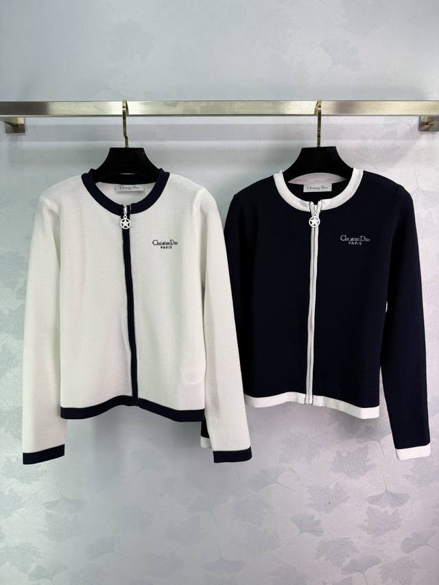 Dio* A black and white colorblock knit cardigan with a classic double zipper des