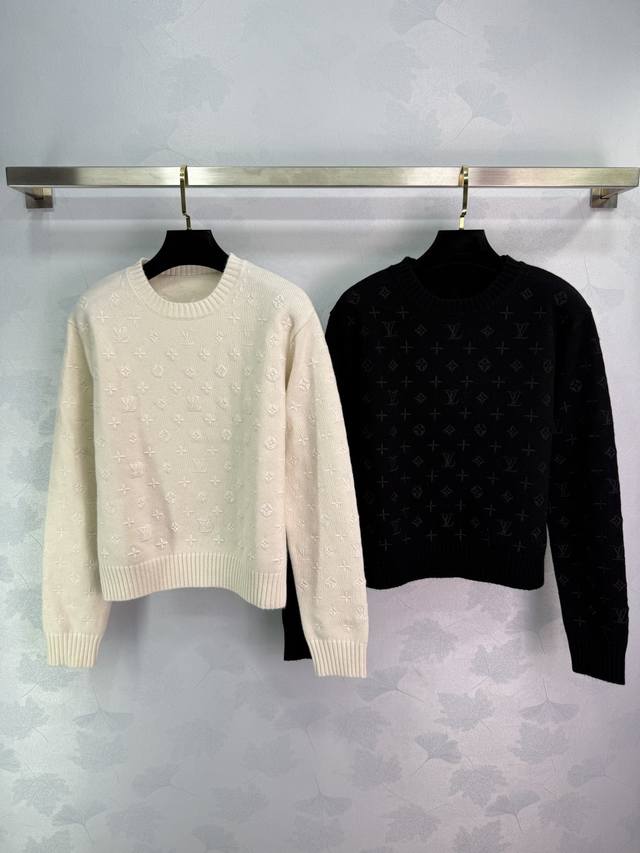 Lou's new all-over printed sweater is available in two colors. It features an al