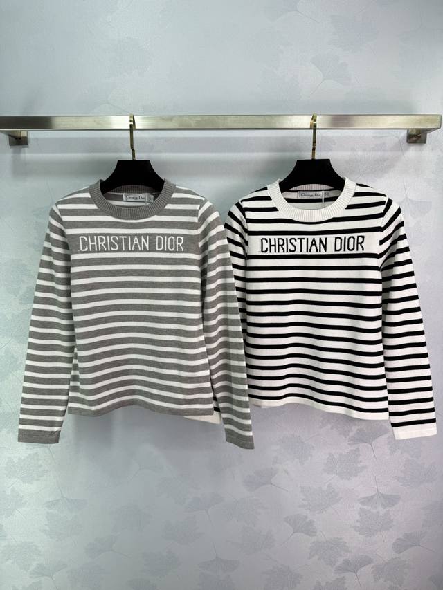 Dio* striped sweater featuring classic striped lettering on the chest. The fabri