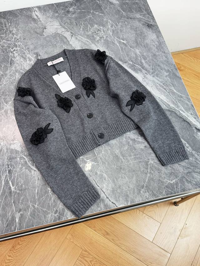 25 New Valentino grey knitted cardigan with a classic V-neck design and neat but