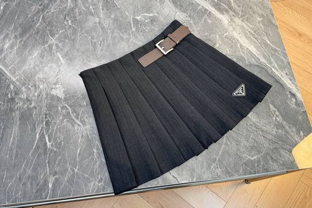 Classic stripes collide with retro pleated Prada triangle logo to inject a fash