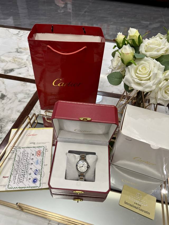 Same packaging as pictured. This Cartier Blue Balloon watch with a steel strap i