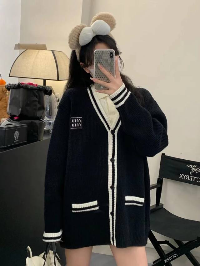 Miumiu's new contrasting cream and white wool knitted cardigan coatMiu still has