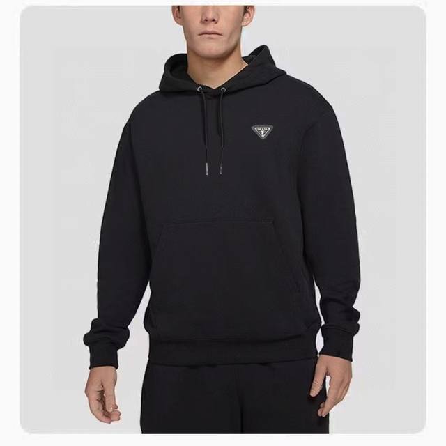 New Arrival : Prada's classic, essential hooded sweatshirt with a metal triang