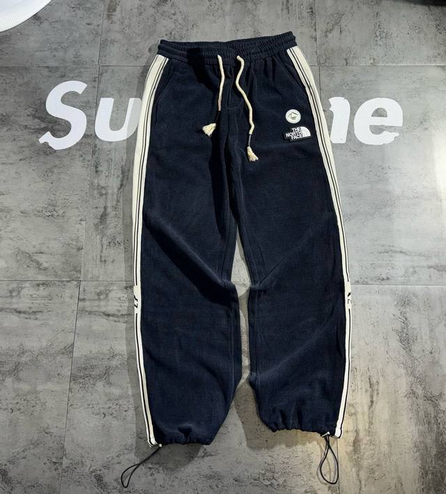 The North Face autumn patchwork couple sports trousers The fabric is breathable