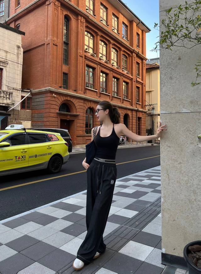 Loewe* Logo ribbon decorated straight pants are particularly good on the upper b