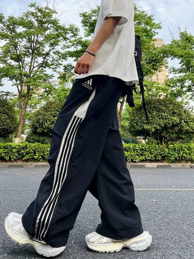 Adidas embroidered summer zippered three-bar trousers with quick-drying design.