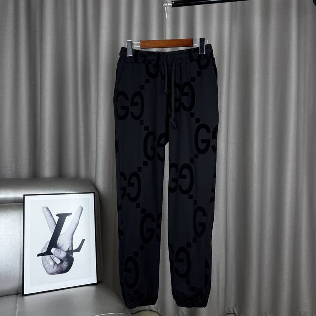 Exclusive product Gucci full-print dark flocked double G cuff trousers with draw