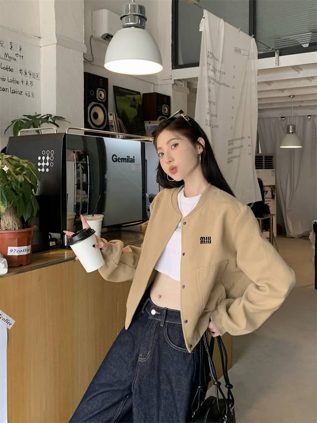 Miumiu Miumiu's early fall baseball jacket looks great on everyone! Today, we're