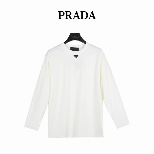 Prada long-sleeved top with a triangle logo at the collar. Made from custom fab